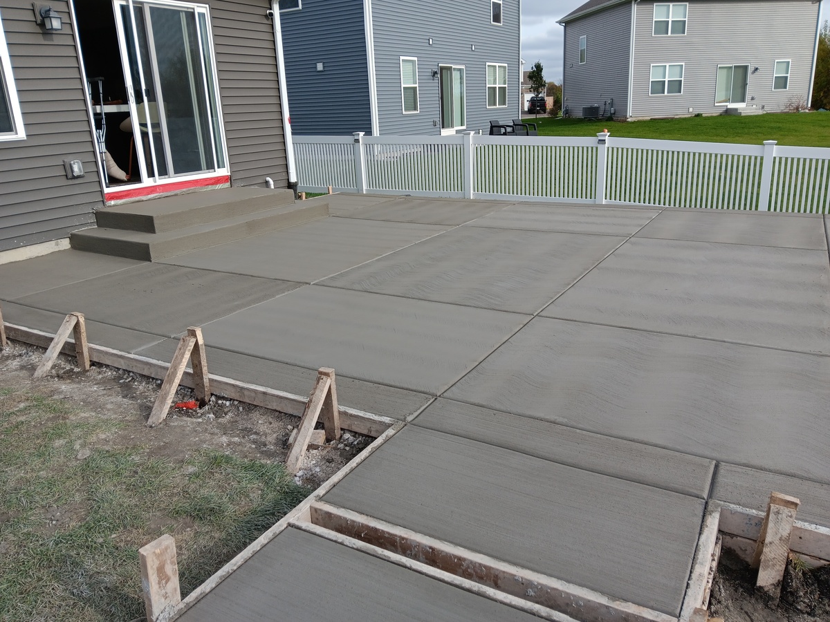 New concrete slab beside a home