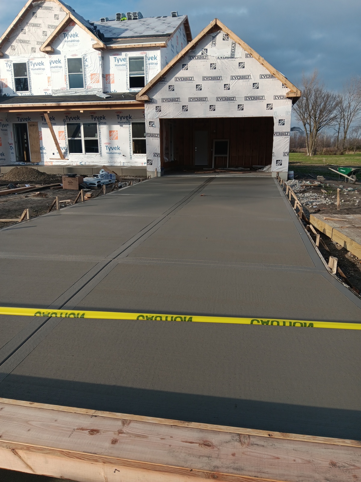 Home with a finished concrete garage driveway