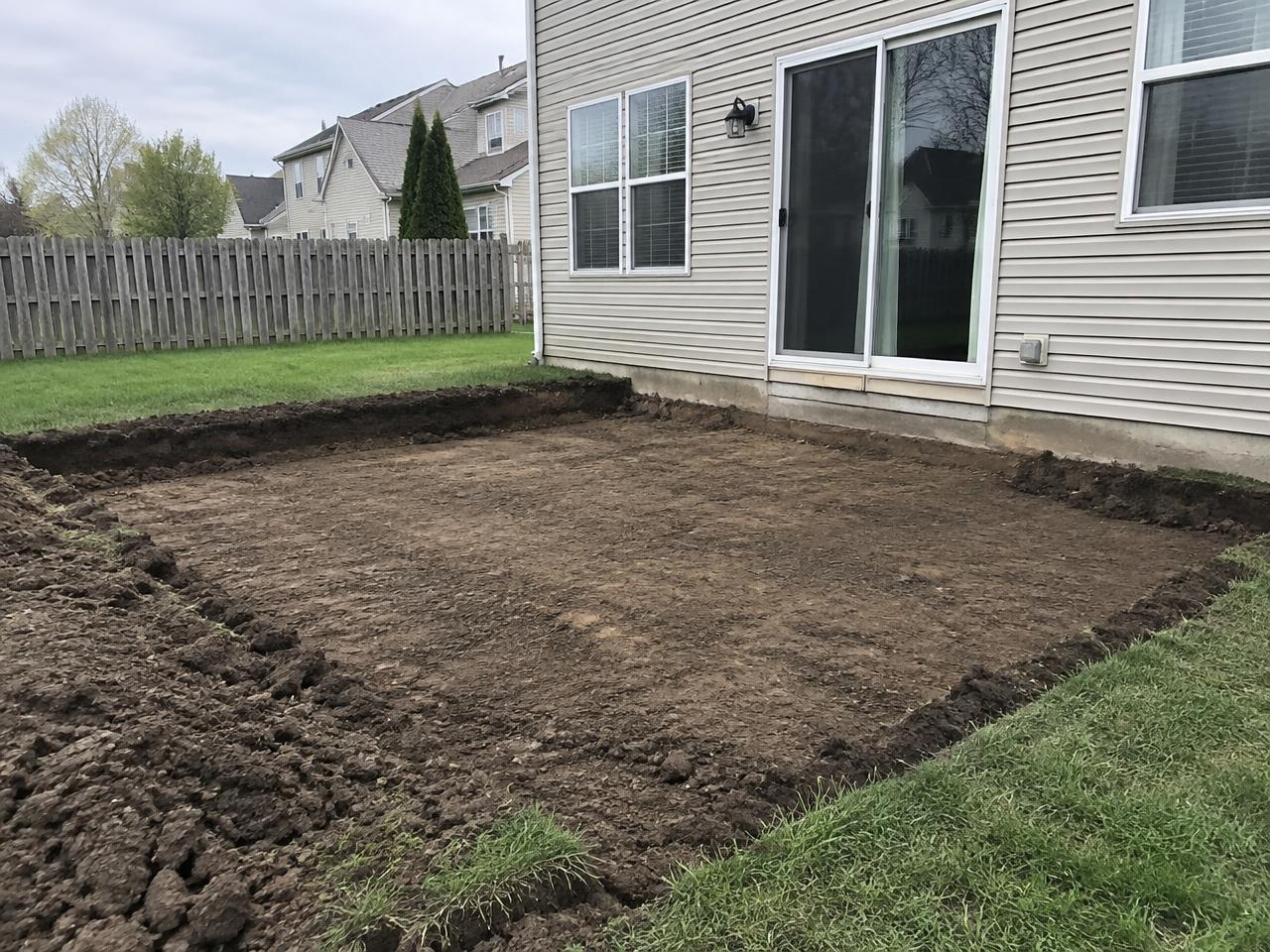 Backyard patio area excavated down to bare soil